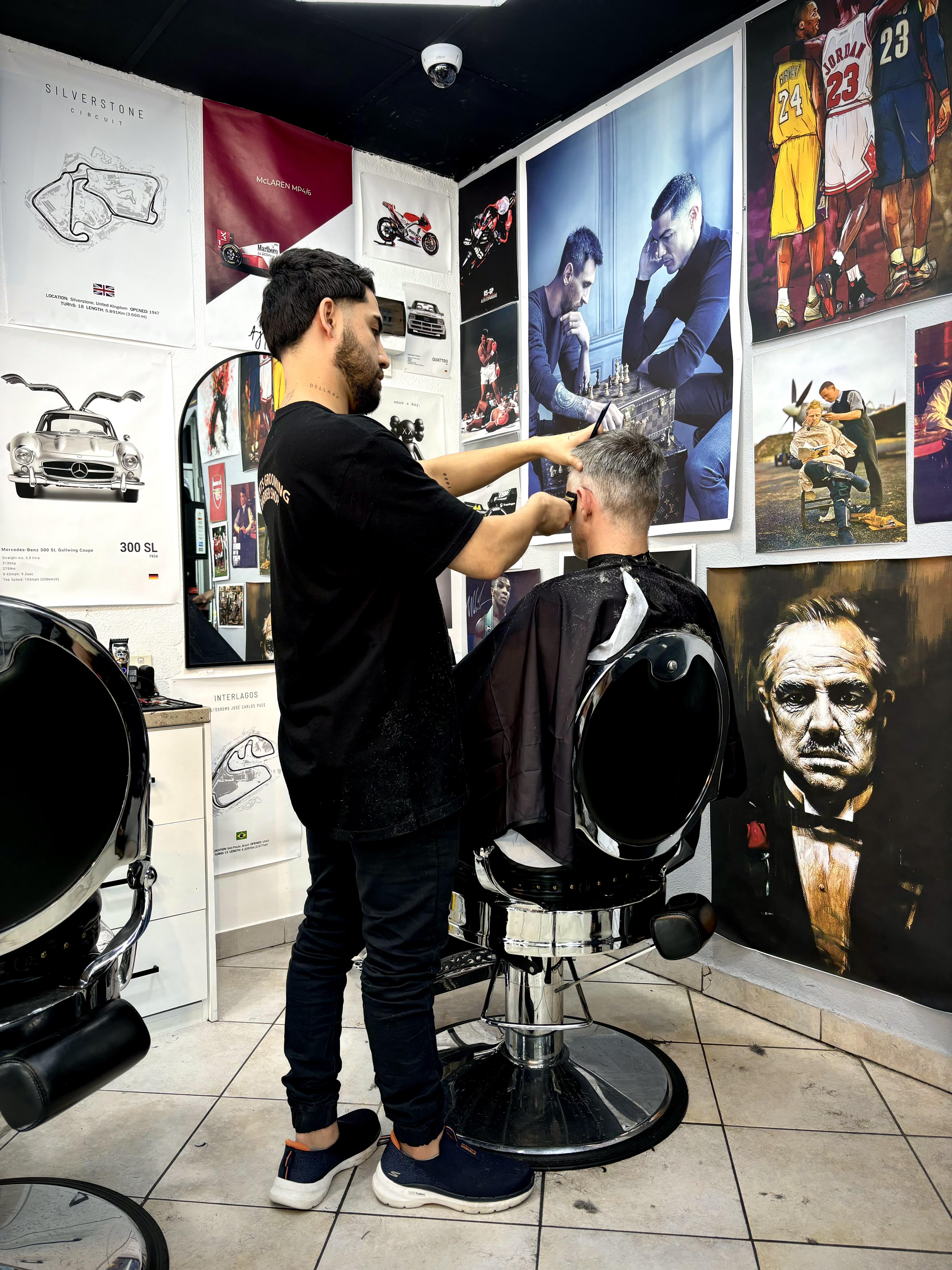 Barber styling a client's hair at Gent's Grooming Beecroft